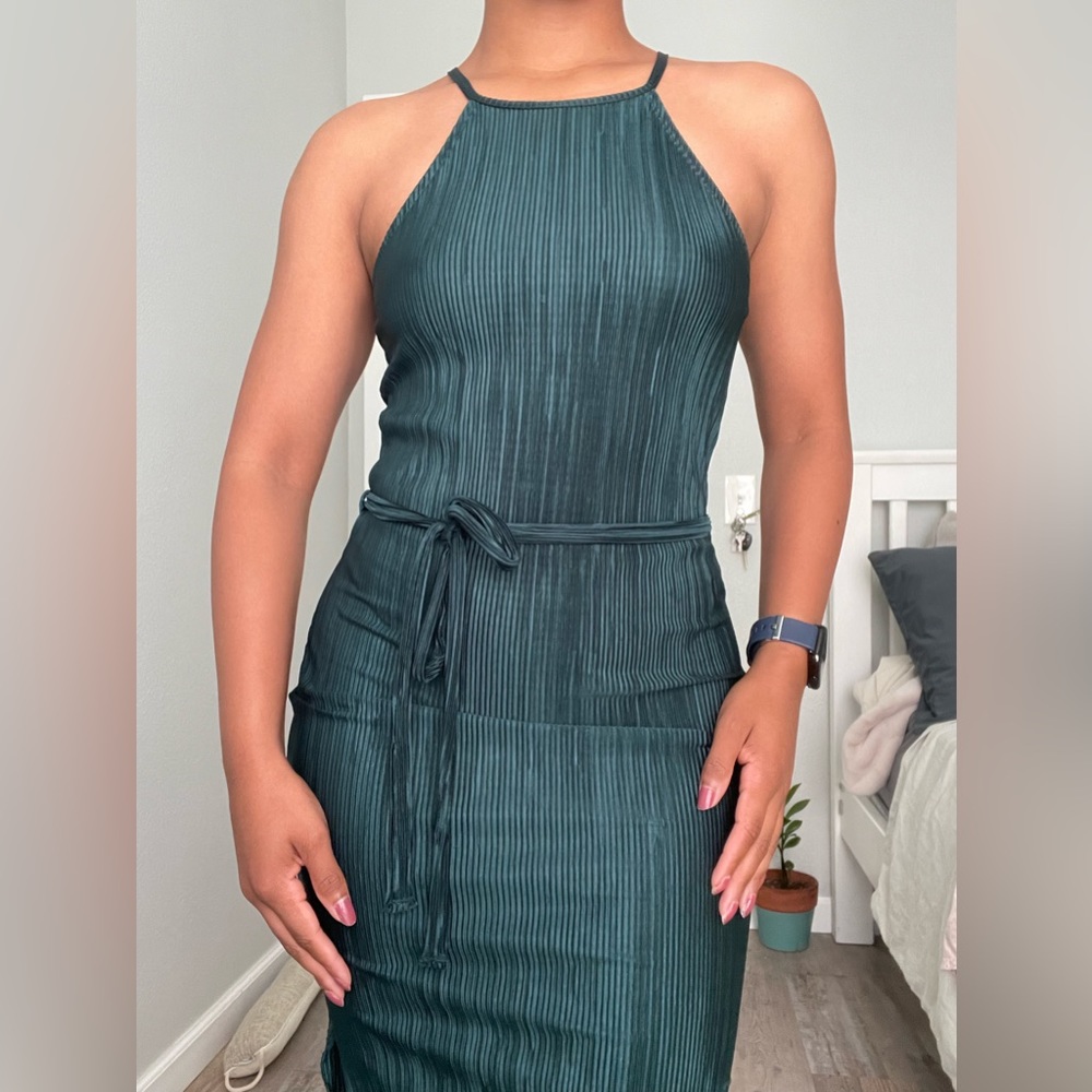 A’GACI Pleated emerald green dress.